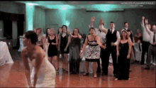 Bridesmaid Falls Trying To Catch Bouquet GIF