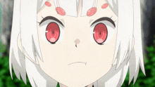 a girl with white hair and red eyes makes a funny face