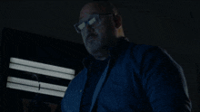 a man is falling through the air in a room with a fireplace