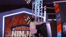 climb up american ninja warrior go up pressing the button on the way to the top