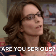 a woman wearing glasses is making a funny face and saying `` are you serious '' .