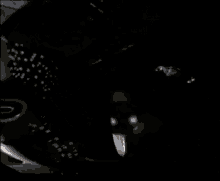 a rocket is being launched into space in a dark room .