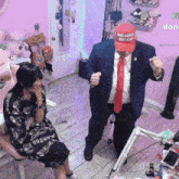 a man in a suit and tie wearing a maga hat