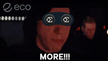 a man with a mask on his eyes is screaming and the word more is on the bottom