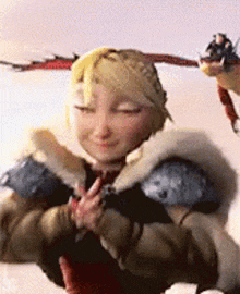 a woman in a fur coat is holding a dragon in her arms and smiling .