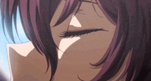 a close up of a girl 's eye with purple hair