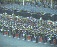a marching band with a flag that says ' s.s. ' on it