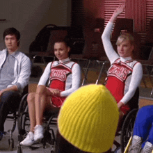 a group of cheerleaders wearing red and white uniforms that say cheerleaders on them