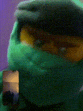 a close up of a lego ninjago character with a green mask