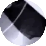 a close up of a black object in a circle on a white surface .