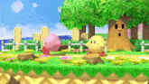 kirby and pac man are playing a video game in a garden