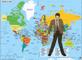 a man standing in front of a world map