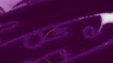 a purple background with a silhouette of a man standing on top of a rock .