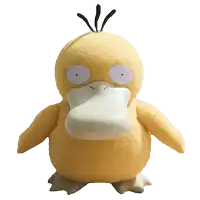 a stuffed yellow duck with a white beak and a purple eye