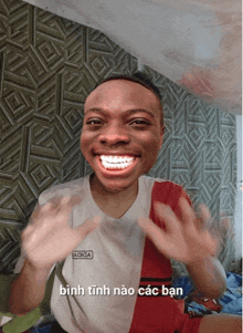 a man with braces on his teeth is wearing a shirt that says a ciga