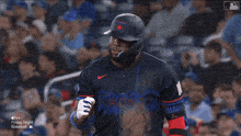a baseball player wearing a jersey that says toronto