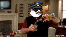 a man wearing a hat with the letter g on it pouring a drink into a glass
