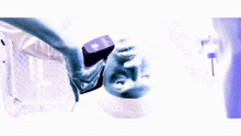 a purple and white image of a person 's face