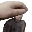 a hand is holding a man 's head in a pixel art .