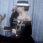 a woman wearing a black dress and a white hat with the words zendaya hat theory on the bottom