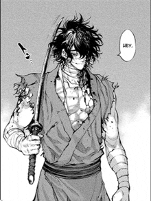 a man in a kimono is holding a sword in his hand .