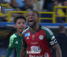 a soccer player wearing a jersey that says ettigoat is celebrating