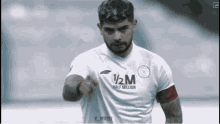 a soccer player wearing a half million shirt