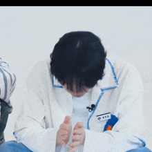 a person wearing a name tag that says ' ae ' on it