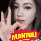 a woman 's face is behind a red sticker that says " mantul "