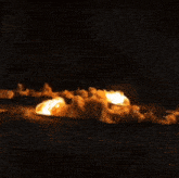 a large explosion with a lot of smoke and fire coming out of it