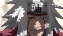 a close up of a man with chinese writing on his head