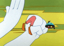 a cartoon of a hand holding a duck 's foot