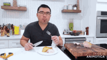 a man holding a knife and fork in front of a plate of food with the words made in animatica on the bottom