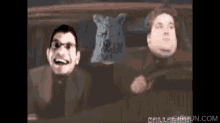 two men are driving a car with their faces on the windshield and a website says hellogigglefun.com