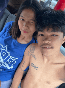 a man without a shirt has a tattoo on his arm that says 2005