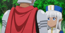 a man and a girl are standing next to each other and the girl has a white hat with the letter b on it
