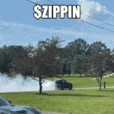 a car driving down a road with the words $ zippin written above it