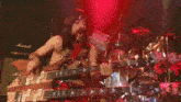 a man is playing a guitar in front of a marshall amp