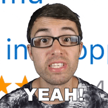 a man wearing glasses says yeah in front of a blue background