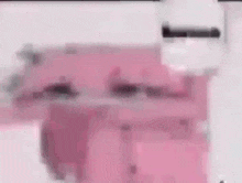 a close up of a pink blender on a white surface .