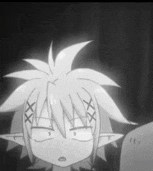 a black and white photo of a cartoon character with a strange face .