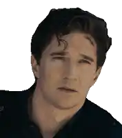 a close up of a man 's face with a black shirt on