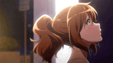a girl with a ponytail looks up at the sun