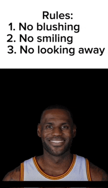 a man in a basketball uniform is smiling with rules written above him .