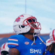a football player wearing a blue smu jersey