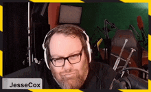a man wearing headphones with the name jessecox on the bottom