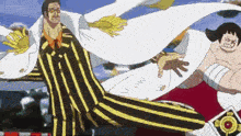 a man in a yellow and black striped suit is standing next to a man in a white cape .