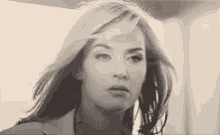 a black and white photo of a woman 's face .
