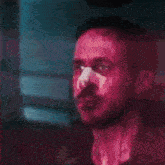 a man in a dark room with the letter d on the bottom