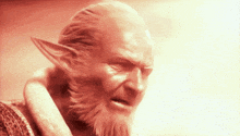 a man with a beard and elf ears has a red background